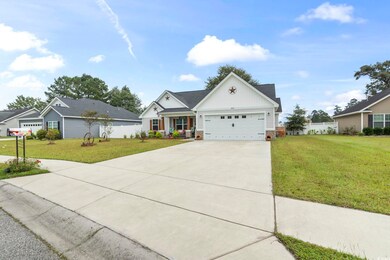 View of front of property featuring a garage and a