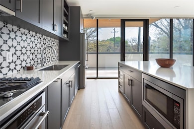 Kitchen featuring a sink, stainless steel applian