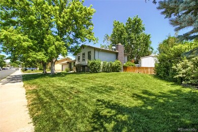 green grass and mature trees