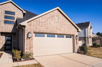 This is a modern brick two-story home with a spaci