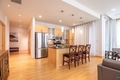 Kitchen featuring stainless steel appliances, ligh
