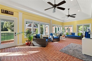 Sunroom / solarium featuring a tray ceiling and ce