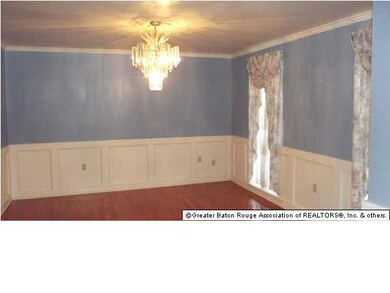 An Interesting Chandelier Accents The Formal Dinin