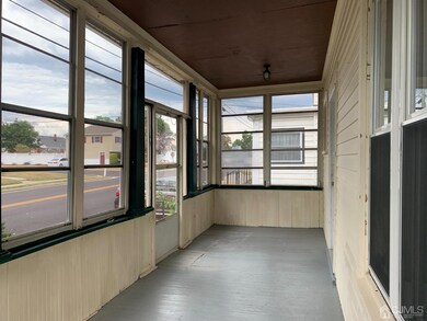 Shared Enclosed Front Porch and Entrance.
