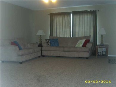 Living room features brand new carpet