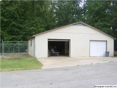Detached 2 car garage/woorkshop and dog run.
