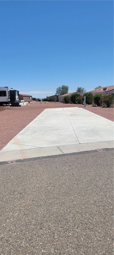 View of patio featuring driveway