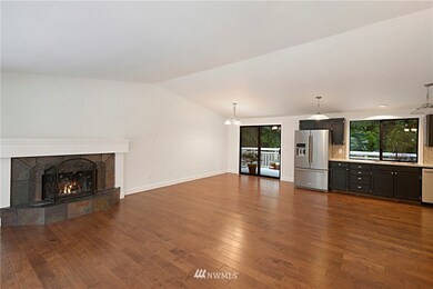 Main Floor living room with wood burning fireplace