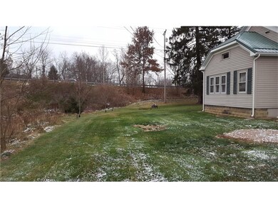 Large side yard and a firepit on the property as w