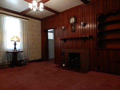 Living Room. LVRM has deco FP, beamed ceiling, and