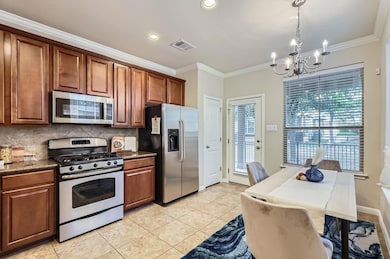 Kitchen with stainless steel appliances, tasteful