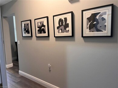 Hallway with dark wood-type flooring