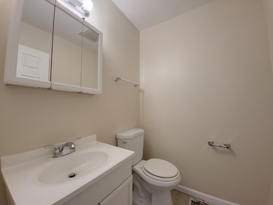 Main level half bath with updated vanity and light