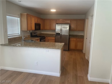 Kitchen featuring appliances with stainless steel