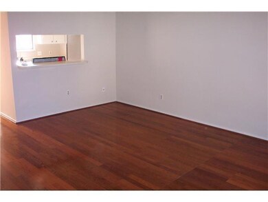 Unfurnished room featuring dark wood-type floorin