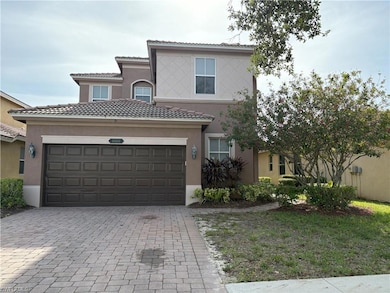 Mediterranean / spanish-style home with decorative driveway, stucco siding, a garage, and a tile roof