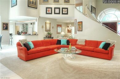 Two story family room with Palladian windos overlo