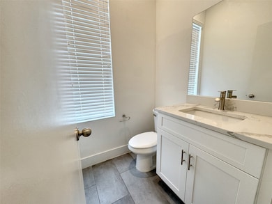 Bathroom featuring vanity and plenty of natural light