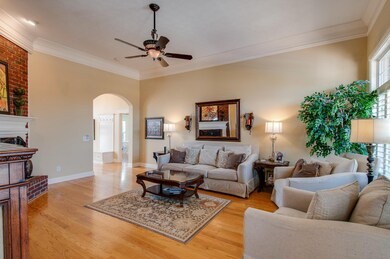 Hardwood floors through Entry Foyer, Dining, Living Room, Bedrooms, Hallways and Bonus Room. Tile Baths.