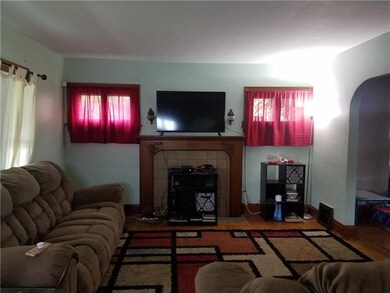 Living room with hardwood flooring and decorative 