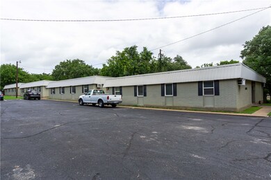 View of building exterior featuring uncovered park
