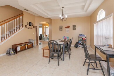 Formal dining with coffered ceiling, ceramic tile 