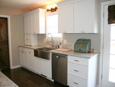 Big stainless farm sink, quiet dishwasher, laminate floors, and granite counter tops.