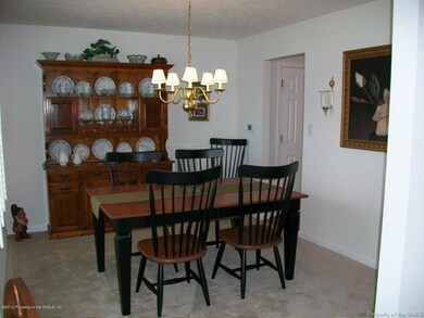 Dining rm has pretty Plantation Shutters