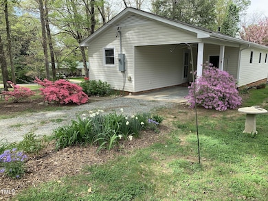Lush plantings view to carport