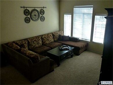 Large living room giant windows and soaring ceilin