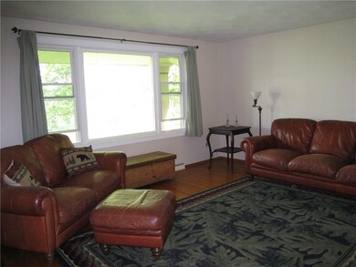 Living Room with new windows hardwood floors opens
