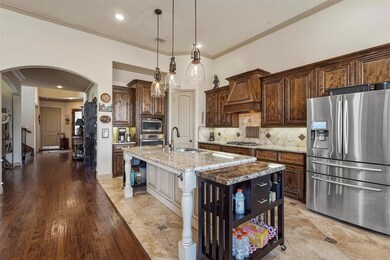 Kitchen featuring premium range hood, stainless st
