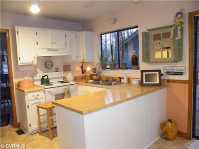 Kitchen - has new flooring opens into dining room