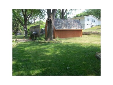 Yard. Flat backyard surrounded by fencing. There i