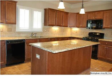 Large open kitchen with granite counters.