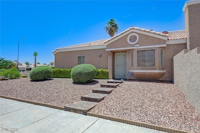 View of front of property with stucco siding and a