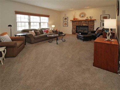 Family Room. Spacious Family room features extra windows, recessed lighting and handsome stone gas fireplace!