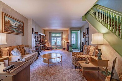 Large living room with beautiful stained glass win