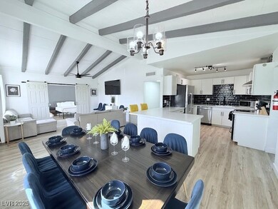 Dining area featuring light wood-type flooring and a chandelier