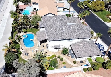 Aerial view of property's location featuring a pool area