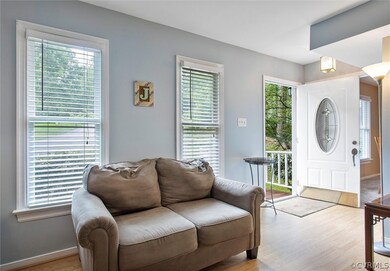 Entry into the foyer with beautiful paint colors inside to welcome you home.
