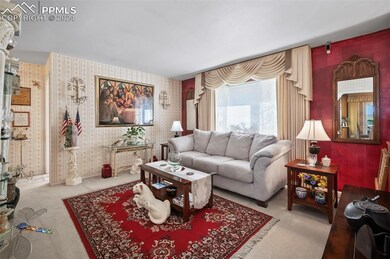 Living Room with front Bay Window and Custom Drape