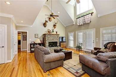 Beautiful wood floors grace the living areas of the home.  The natural gas fireplace features stacked stone with a custom mantel.  The foyer, living room and master bedroom have been freshly painted.