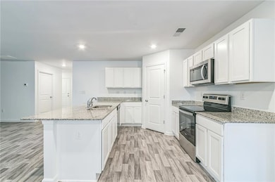 Kitchen featuring appliances with stainless steel 