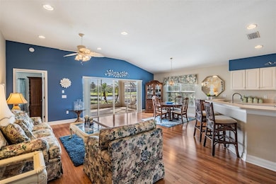 Living area with lanai and water views