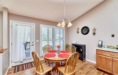 breakfast room with plantation shutters & door to 