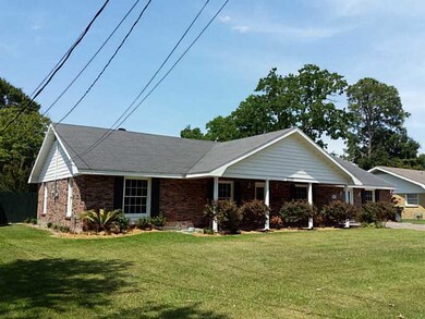 Exterior Front. NEW LANDSCAPING, SHUTTERS AND TRIM