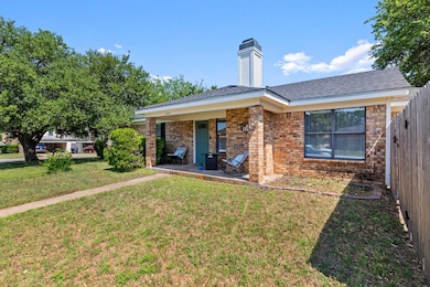 View of front of house with brick siding