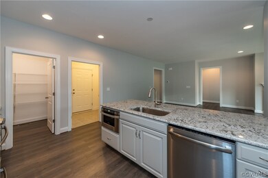 Photos are of a similar home in the community and
