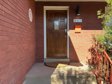 Entrance to property with brick siding